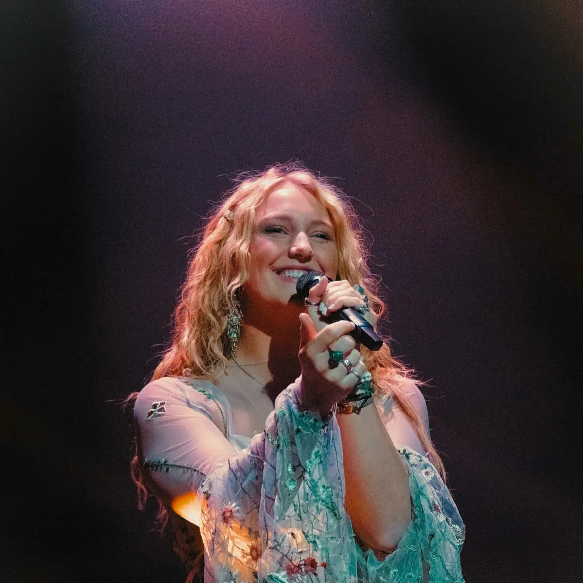 Teacher performing on stage
